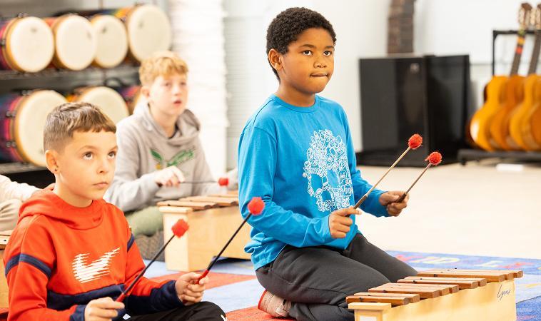 A group of children in a music class