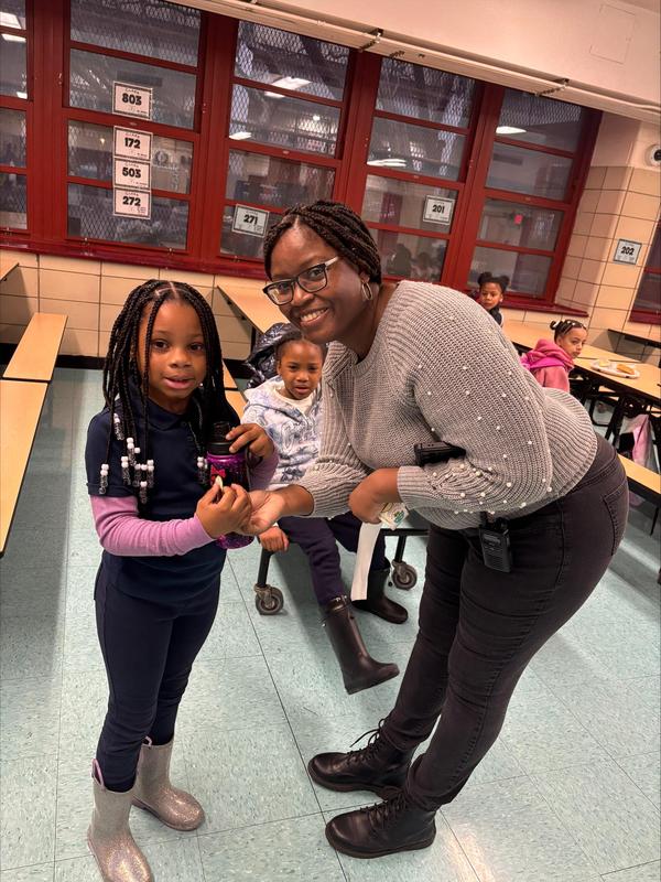 Student and assistant principal with bottle