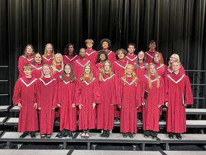 Members of the AAHS Concert Chorus standing on risers.