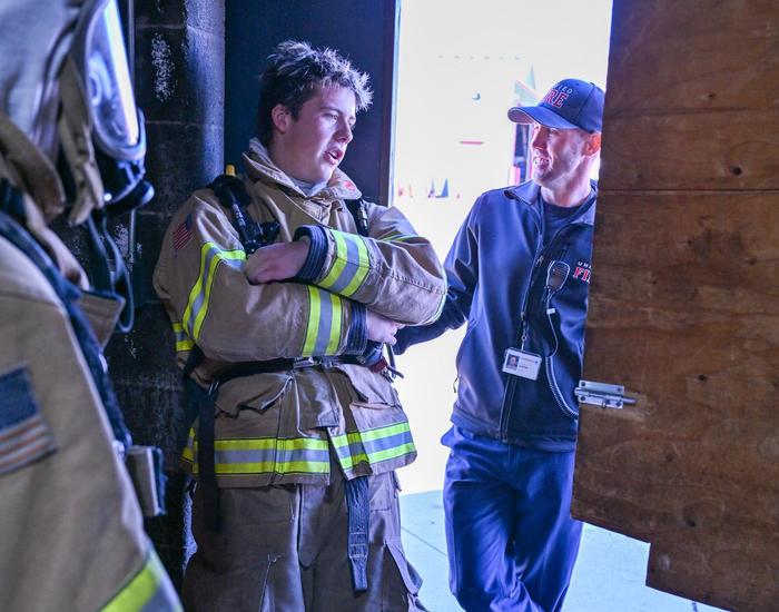 fire science students and teacher laughing