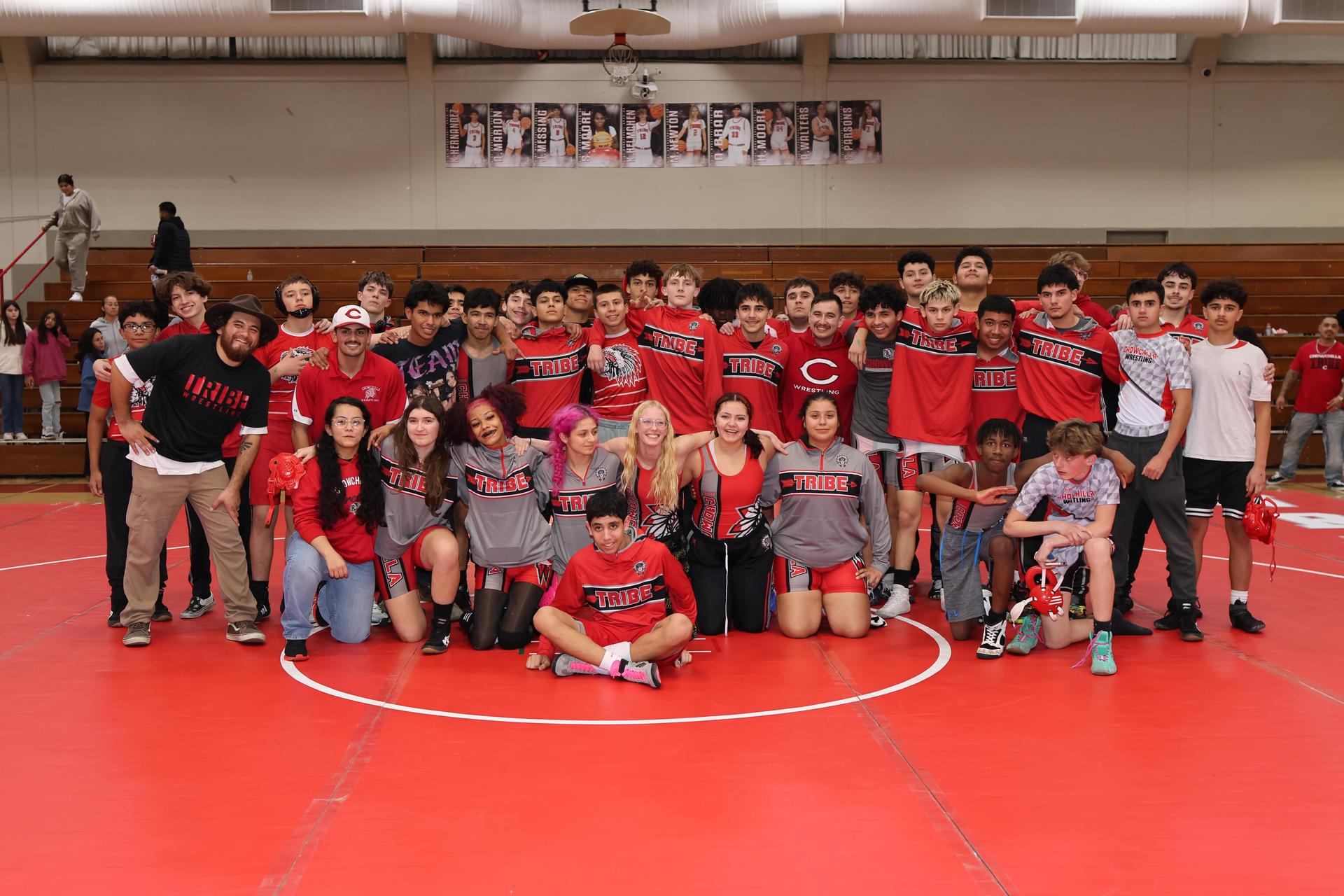Wrestling winners with hands up 140