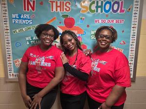 Assistant principals and principals matching in red T-shirt
