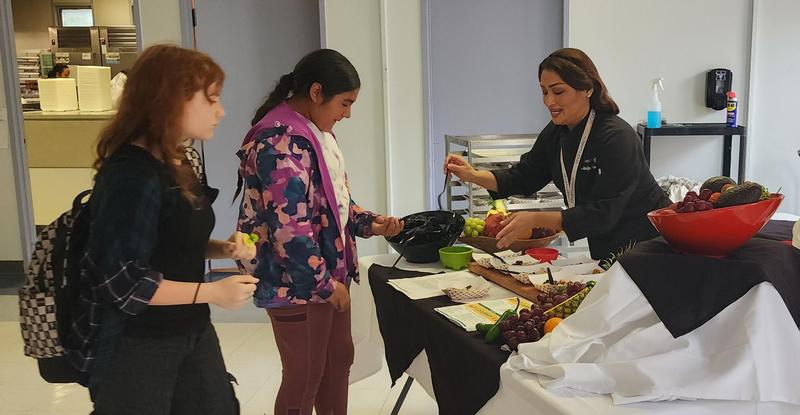 Students speaking to Chef regarding the Caribbean dish