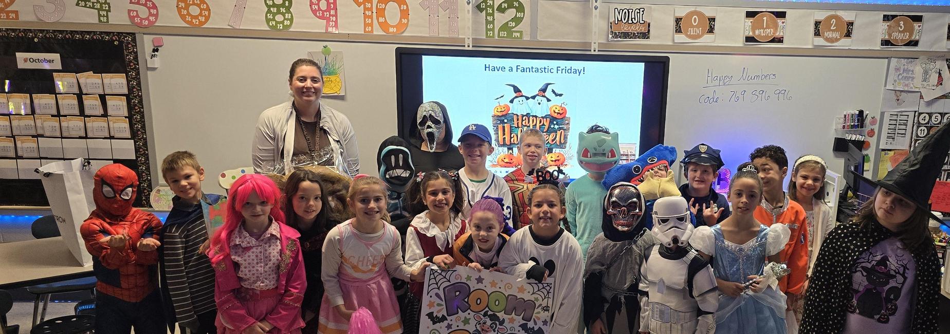 Mrs. Conrad's 3rd grade class picture with Halloween costumes