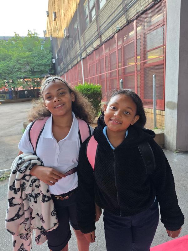 Students smiling on the red carpet