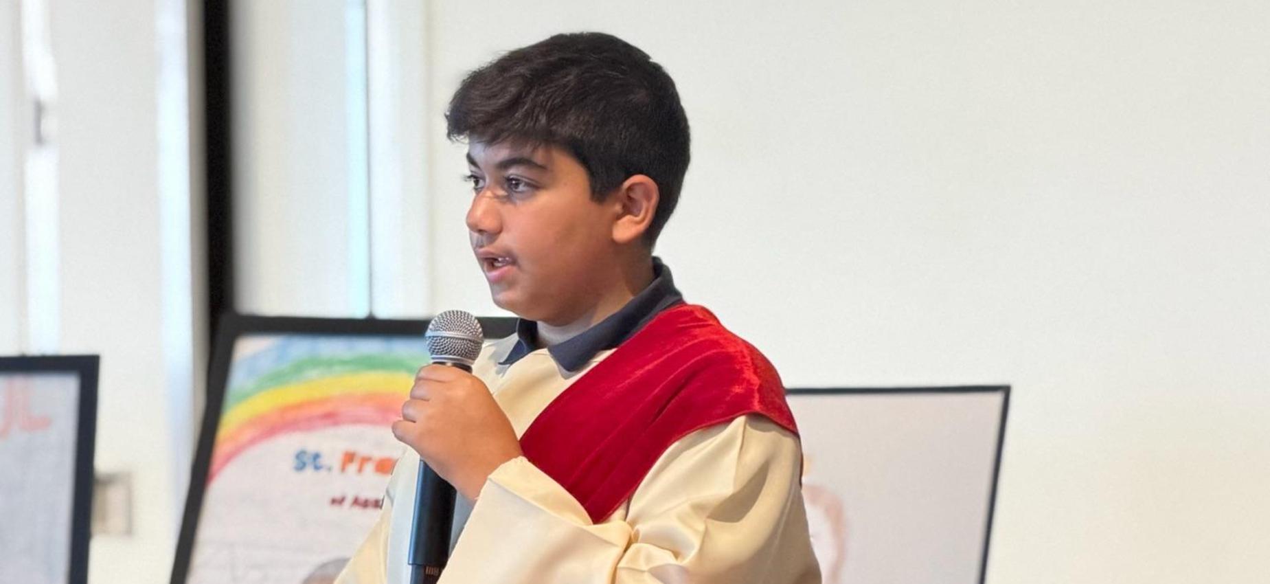 7th grade student dressed as St. Jude presenting about the saint's life