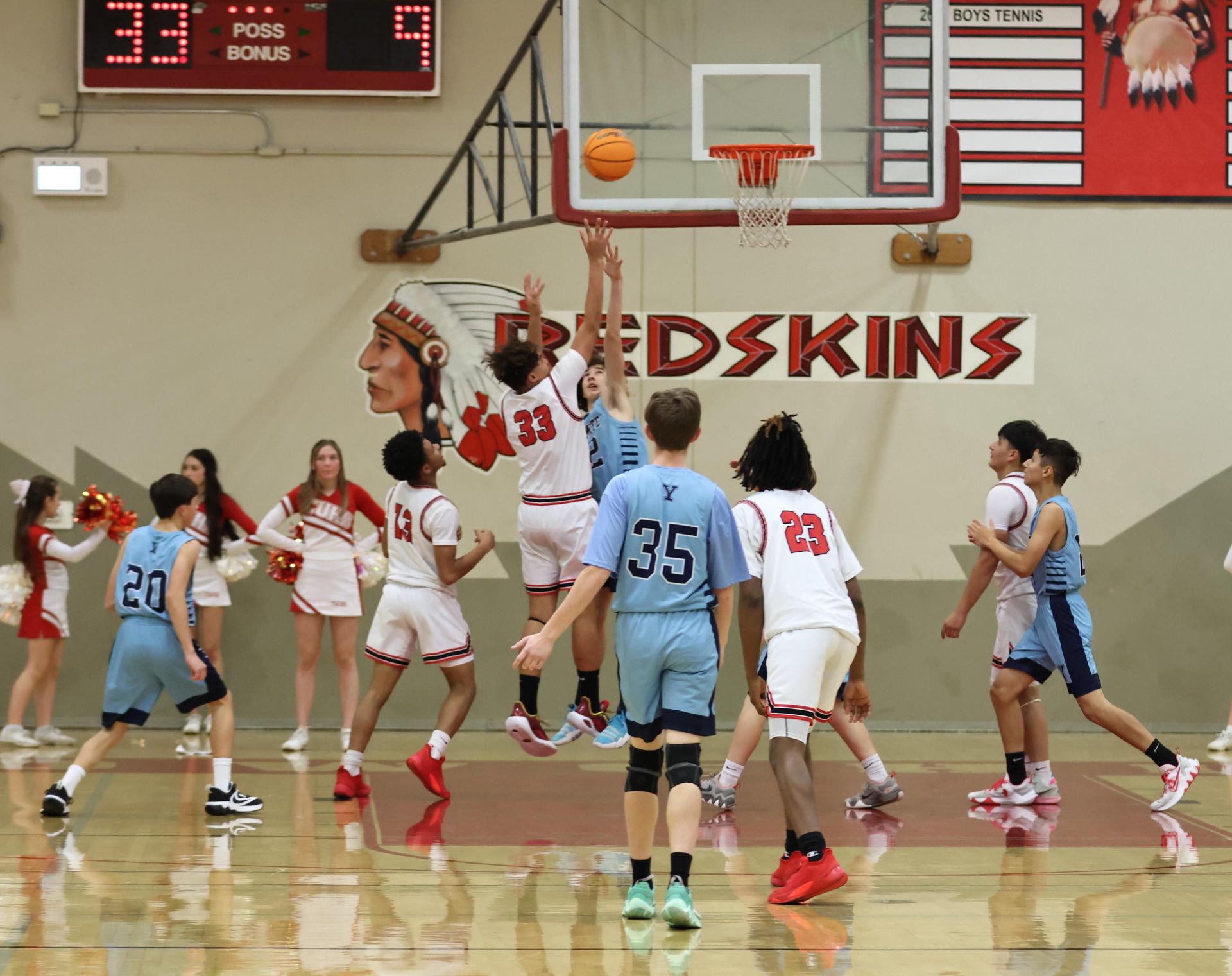 junior varsity boys playing basketball against yosemite