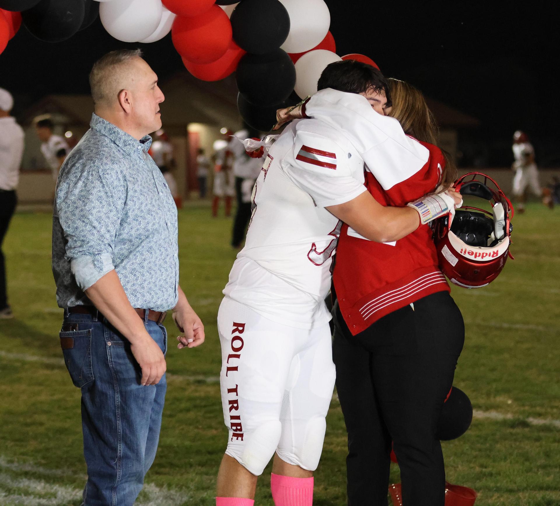 seniors and their escorts celebrating senior night