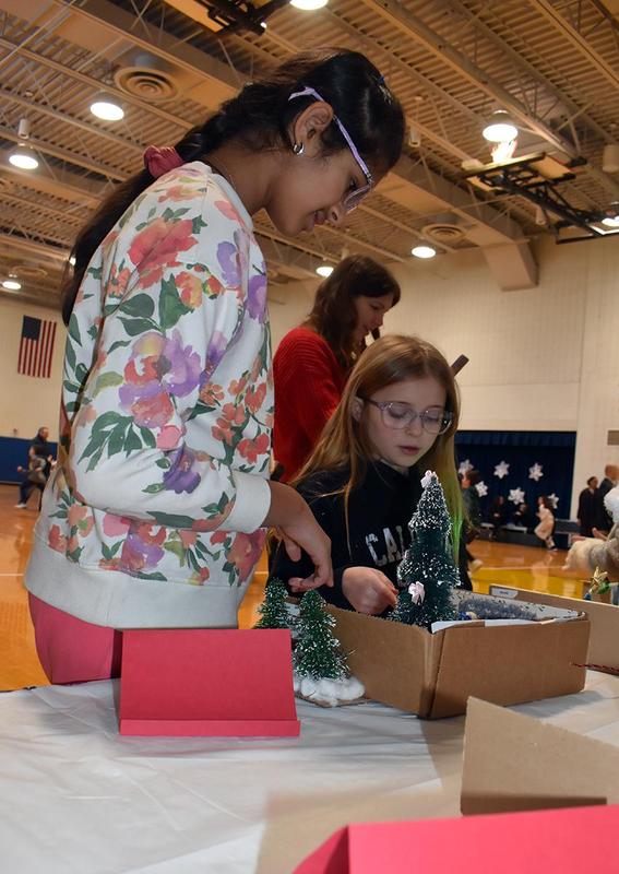 students looking at dioramas based on the movie Home Alone
