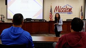 Brenda Zamora giving a presentation in front of an audience