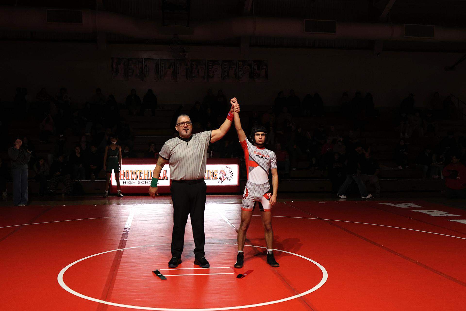 Wrestling winners with hands up 81