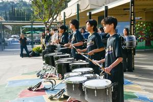The Diamond Bar High School Band performs in the Quad as guests arrive.