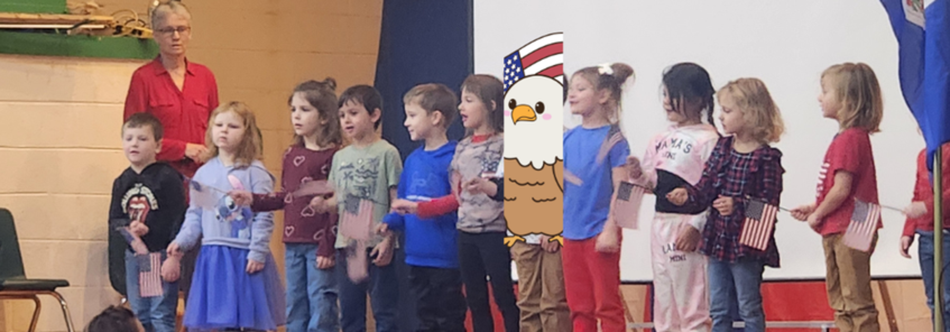 PreK singing "We Love Our Flag" during the Veterans' Day Assembly on November 11