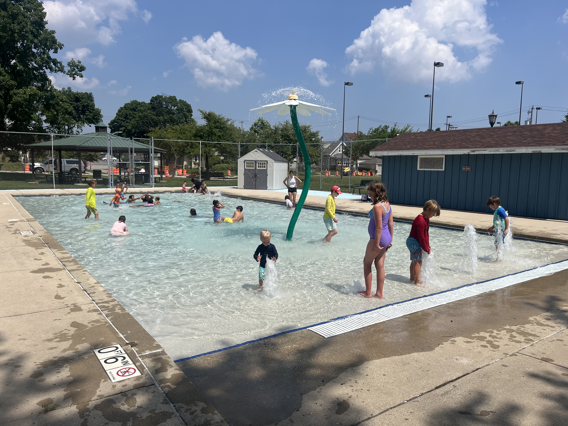 wading pool with kids in water