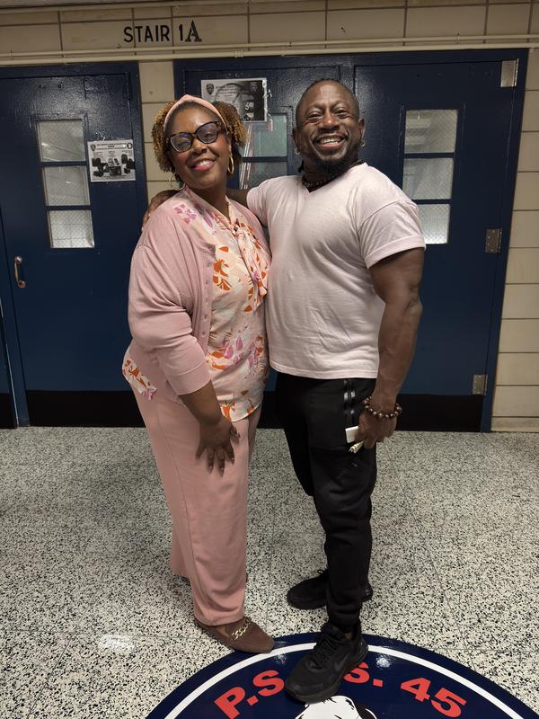 Staff and principal wearing pink