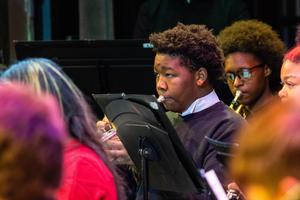 A band member plays their horn