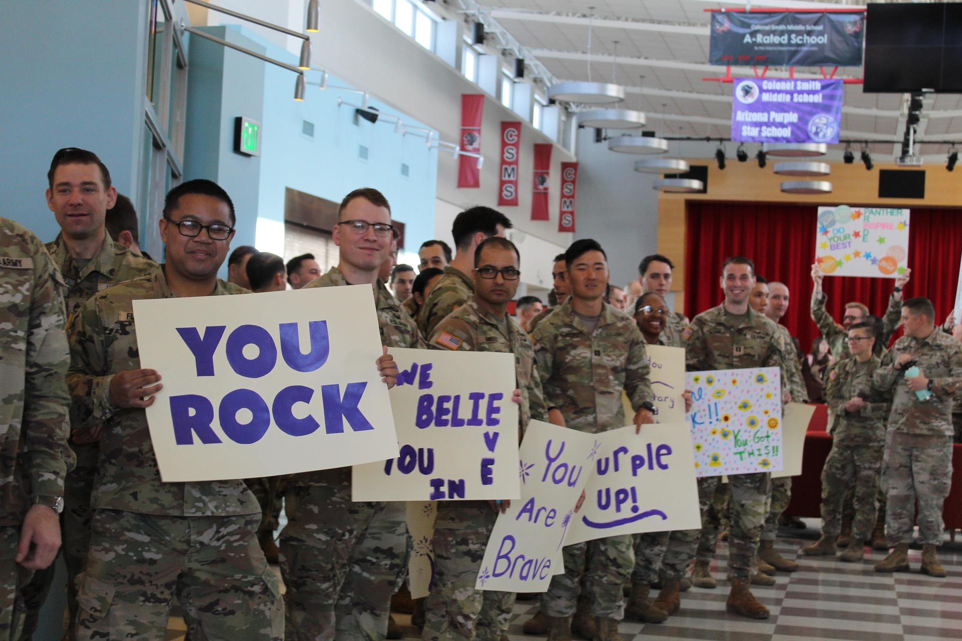 Soldiers showing appreciation to military children