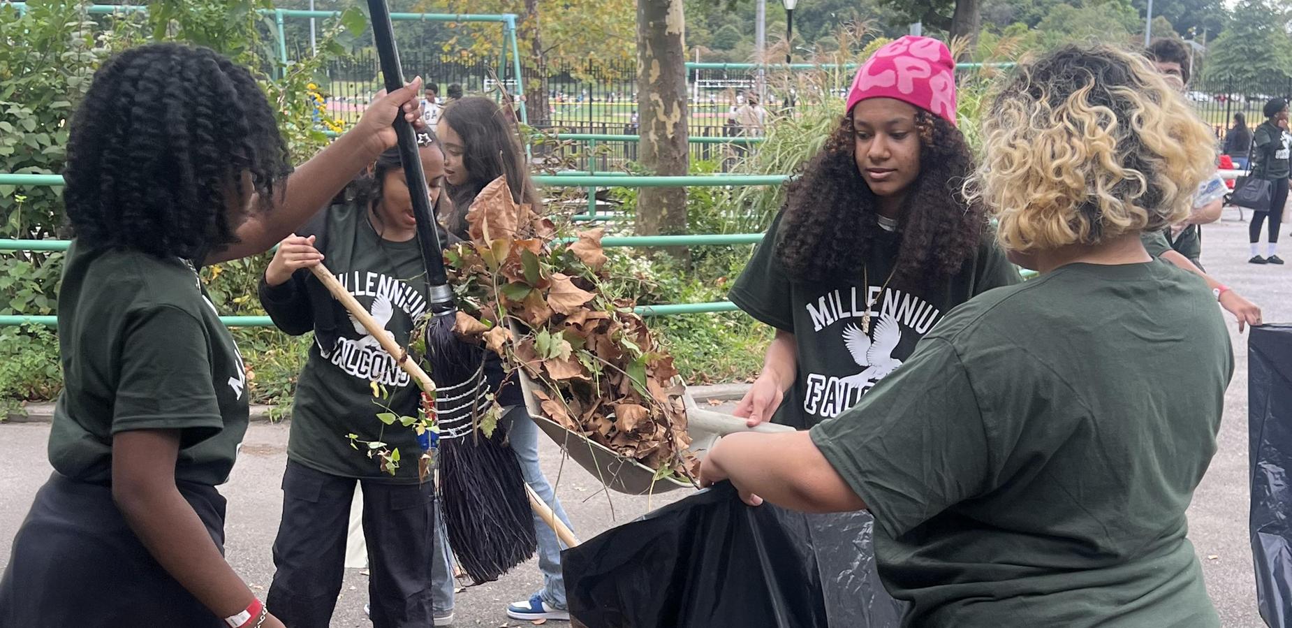 Students cleaning up Pelham Bay Park for community service day.