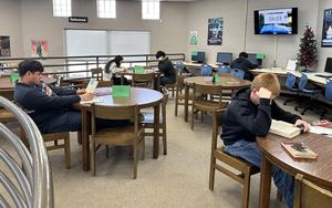 Students reading their choice of books during the book buffet
