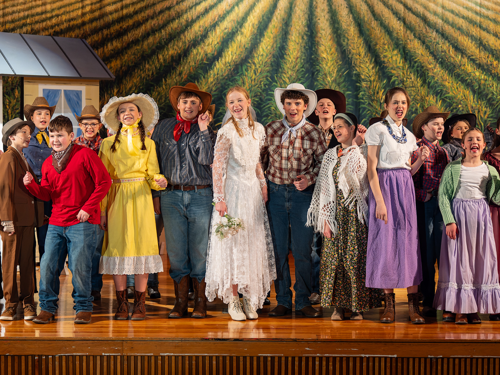 The cast from OKLAHOMA! at a middle school performance.