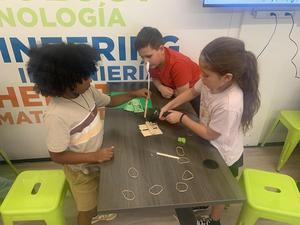 Students collaborate during a catapult building project