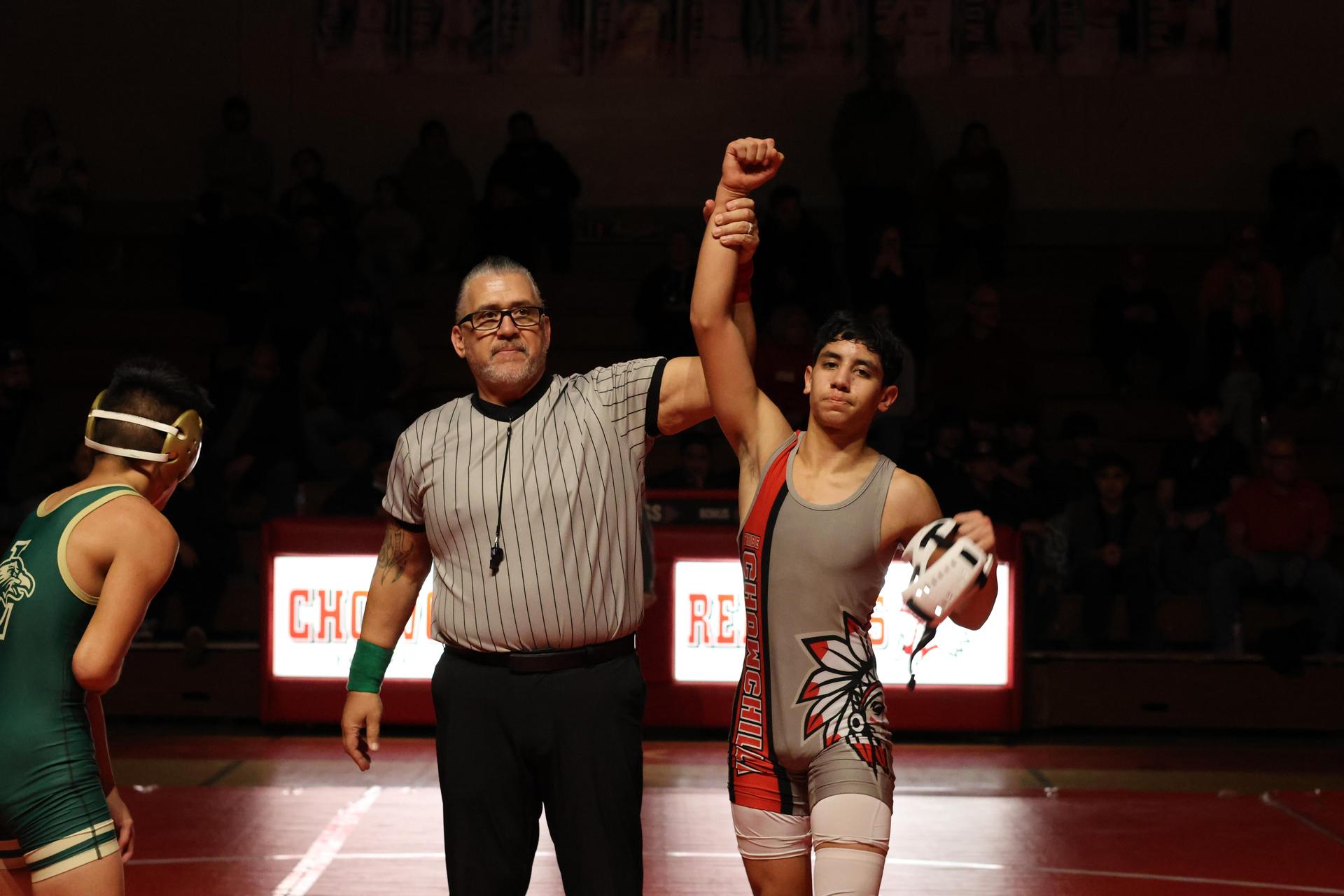 Wrestling winners with hands up 114