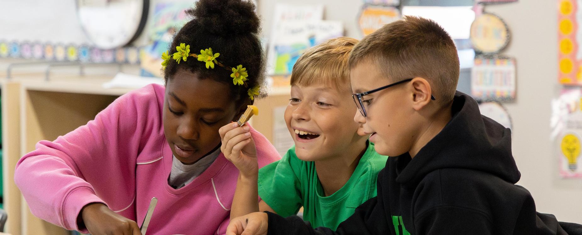 A group of students performing a science experiment.