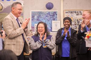 Superintendent Dr. Taylor and Board Members Helen Hall and Larry Redinger applaud Rebecca Chai during a surprise classroom visit announcing her award.