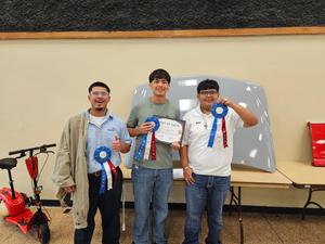 THS paint, body, and collision students pose with their project at SkillsUSA State Competition