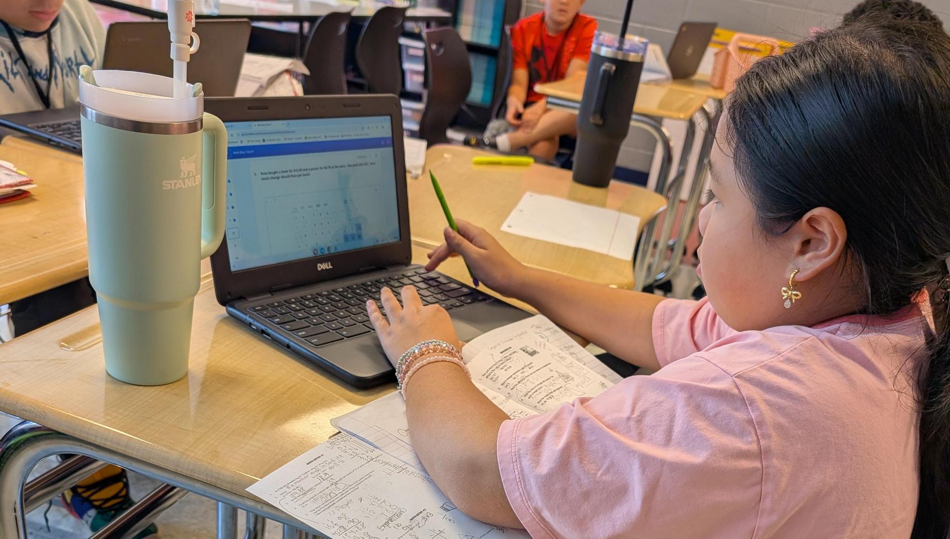 6th grader using her notes to take a quiz