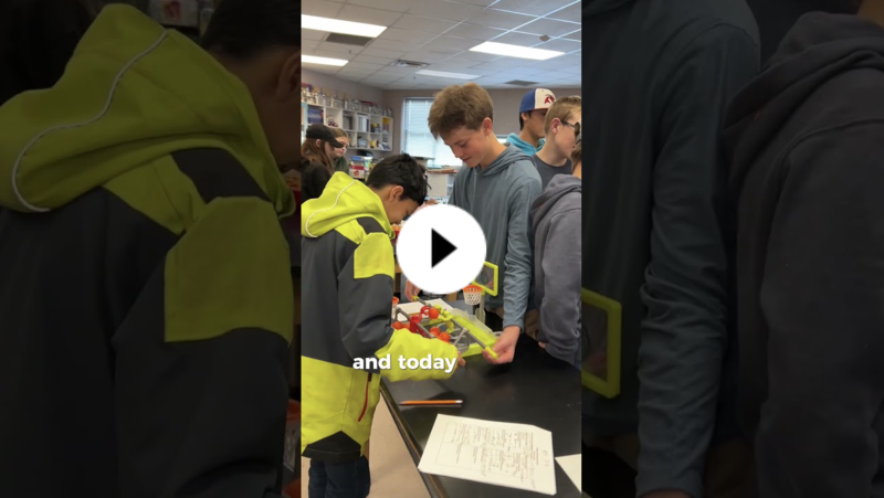 YouTube thumbnail of two middle school students playing a board game with mini basketball hoops.