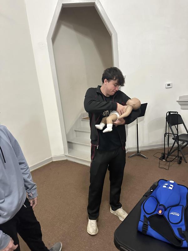 Senior students learning CPR.