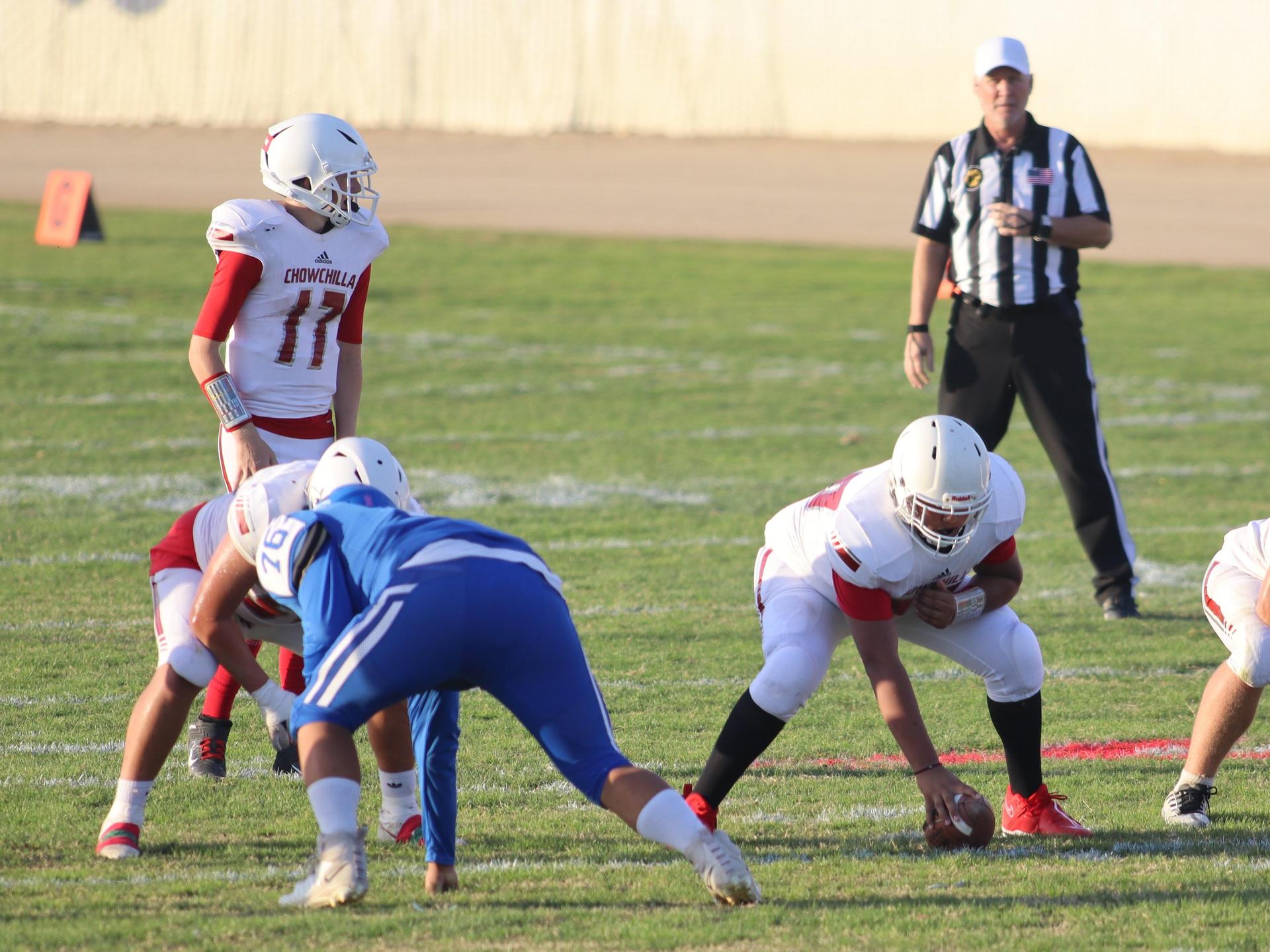 Junior Varsity football players in action against Caruthers