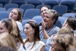 A teacher answers a question during the meeting