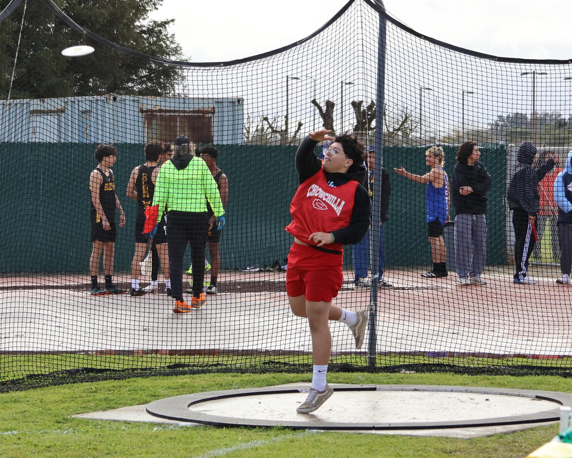 junior varsity boys throwing the discus