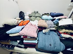 sweaters folded up on table