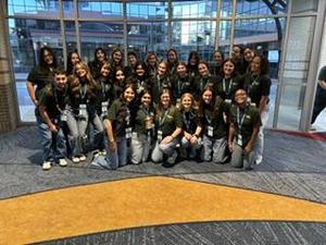 Smiling teens dressed in professional attire