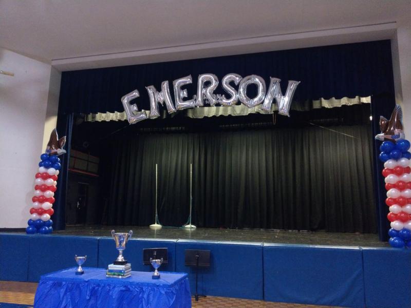 Emerson dressed up stage with ballons and awards