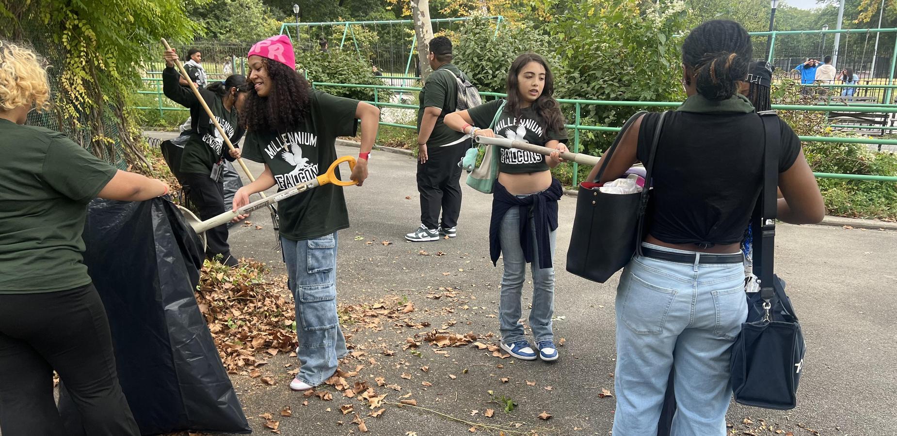 Students cleaning up Pelham Bay Park for community service day.