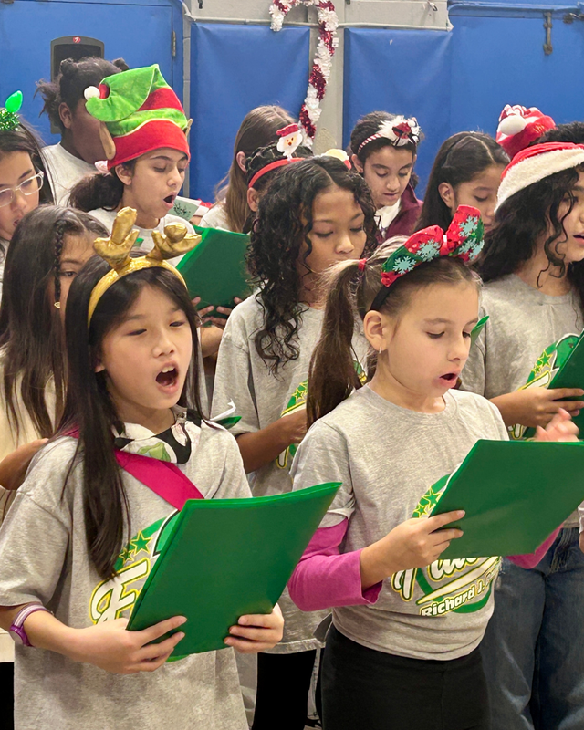 RJB students singing at senior center in festive clothing