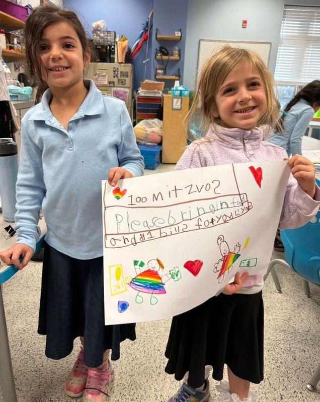 Kindergarteners show off their poster
