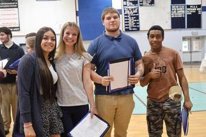 Four seniors attending the Reality Fair