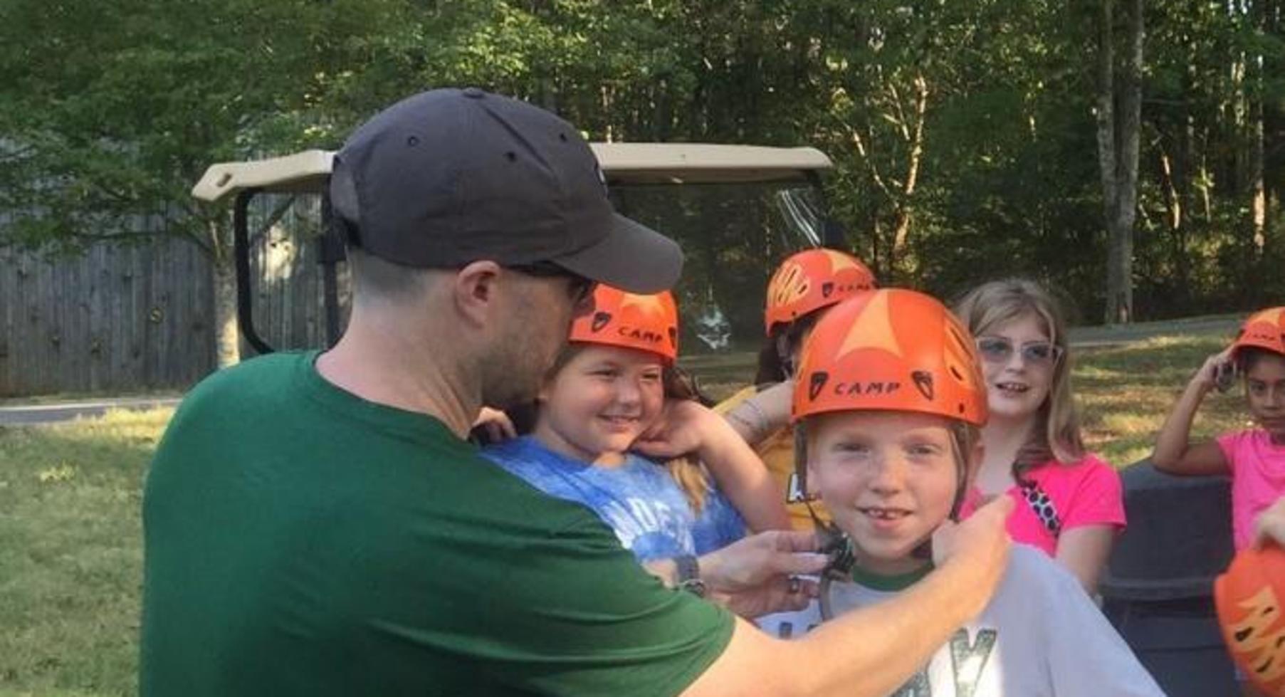 Putting on a helmet.