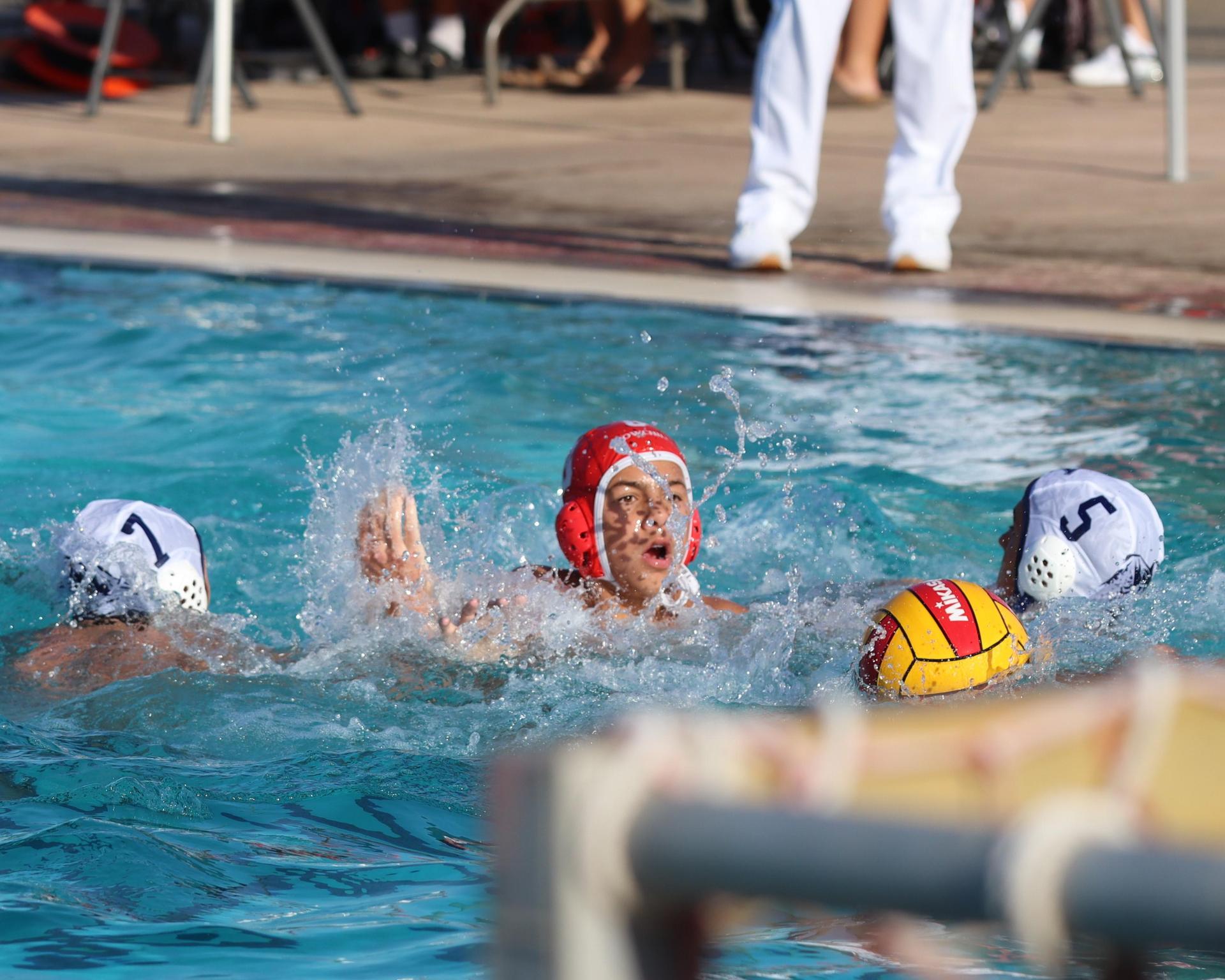Boys playing water polo against Yosemite