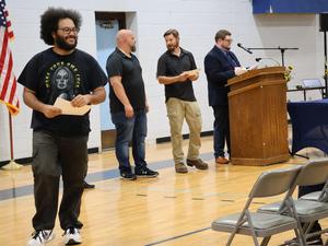 Zachariah Rivera receiving his Carpentry diploma