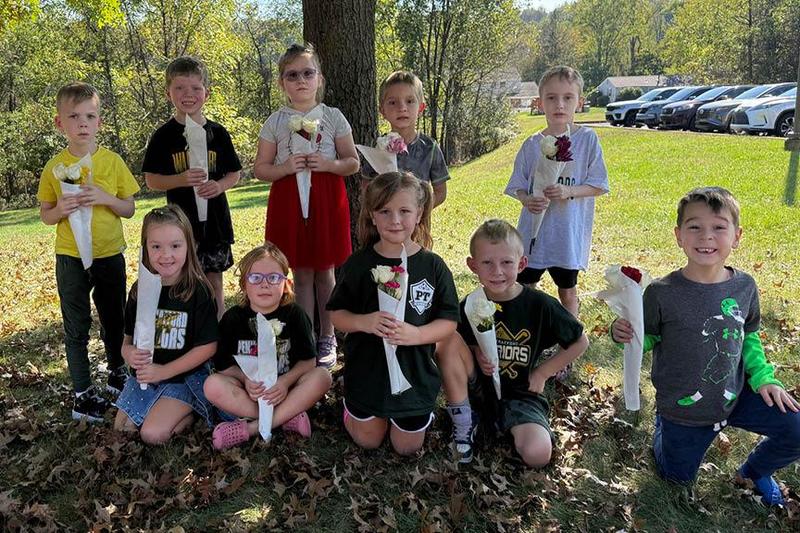 Mrs. Vovaris’s afternoon kindergarten class shows off their kindness blossom bouquets