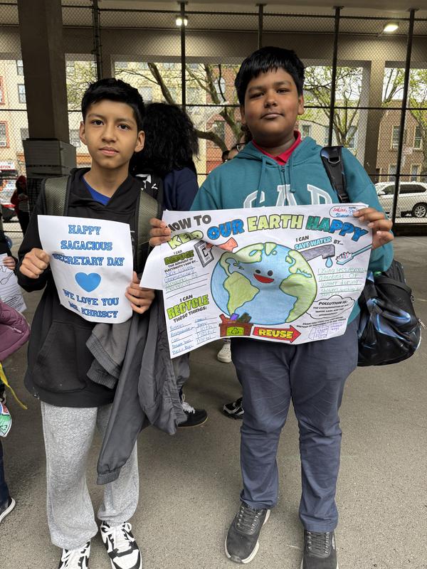 Students with their earth day posters during the pep rally