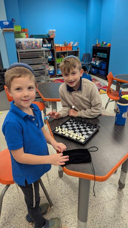 First grade boys playing chess together