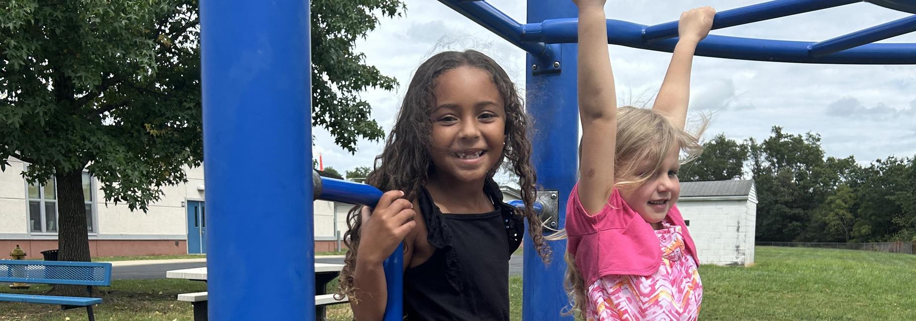 2 girls playing on playground