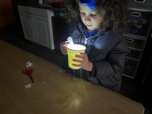 A kindergarten student working on her star projector